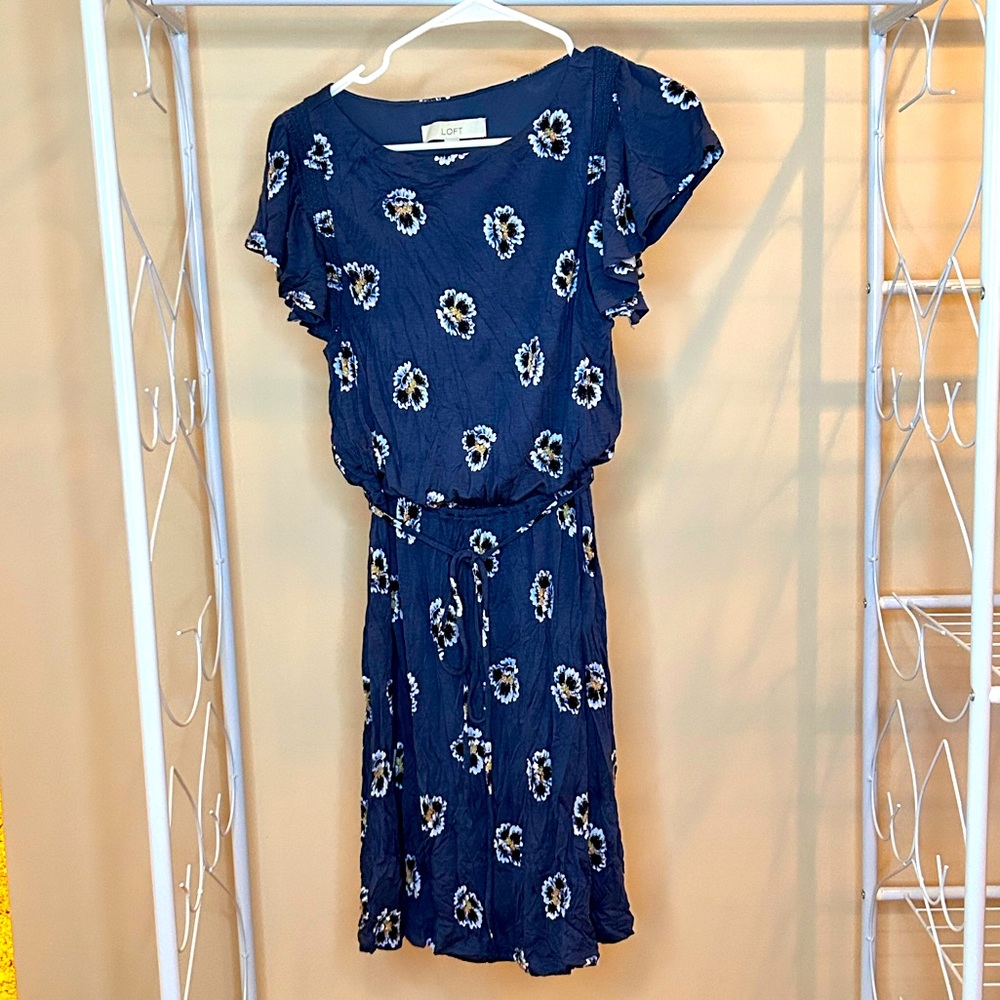 Blue XS dress from Loft with floral design, tie belt, and ruffles on sleeves.